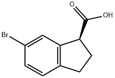 1H-Indene-1-carboxylic acid, 6-bromo-2,3-dihydro-, (1S)- Struktur