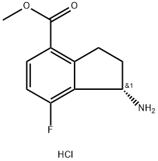 1H-Indene-4-carboxylic acid, 1-amino-7-fluoro-2,3-dihydro-, methyl ester, hydrochloride (1:1), (1S)- Struktur